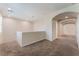 Carpeted loft area with natural light, ideal for a flexible living space at 6125 Paddleboat St, North Las Vegas, NV 89031