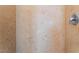 Shower features tiled walls and a chrome shower head at 6125 Paddleboat St, North Las Vegas, NV 89031