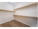 The walk-in closet has carpet and built-in shelving at 6125 Paddleboat St, North Las Vegas, NV 89031