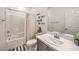 Bathroom featuring a shower-tub combo, stylish decor, and a sink vanity, perfect for everyday use at 617 Sylvan St, Henderson, NV 89002