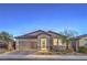 Charming single-story home with a two-car garage, stone accents, and a well-maintained front yard at 617 Sylvan St, Henderson, NV 89002