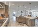 Bright kitchen with a large island, modern appliances, and ample counter space for cooking and entertaining at 617 Sylvan St, Henderson, NV 89002
