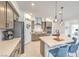 Beautiful kitchen with stone countertops, stainless steel appliances, and stylish pendant lighting over the island at 617 Sylvan St, Henderson, NV 89002