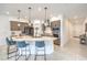 Modern kitchen featuring a large island, pendant lighting, stainless steel appliances, and ample cabinet space at 617 Sylvan St, Henderson, NV 89002