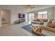 Inviting living room with a comfortable sectional sofa, entertainment center, and access to the backyard at 617 Sylvan St, Henderson, NV 89002