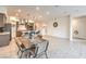 Open-concept living space with tile floors, dining area and kitchen views at 617 Sylvan St, Henderson, NV 89002