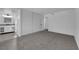 Bright bedroom with neutral walls, plush carpeting, closet space, and attached bathroom vanity area at 6791 Greengrove Dr, Las Vegas, NV 89103