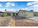 Charming single-story home boasting a two-car garage and low-maintenance desert landscaping at 6791 Greengrove Dr, Las Vegas, NV 89103