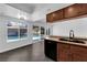 Updated kitchen boasting stainless steel appliances and a view of the backyard pool area at 6791 Greengrove Dr, Las Vegas, NV 89103