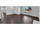Open living room features tile floors, neutral walls, and a large window at 6791 Greengrove Dr, Las Vegas, NV 89103
