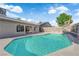 Backyard oasis featuring a sparkling blue swimming pool and covered patio at 6791 Greengrove Dr, Las Vegas, NV 89103