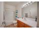 Bathroom features a single sink vanity, toilet, and shower-tub combination with a blue shower curtain at 689 Bay View Dr # 1311, Boulder City, NV 89005