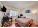 Bedroom with hardwood floors, large window, accent lighting, and a workspace perfect for a home office at 689 Bay View Dr # 1311, Boulder City, NV 89005