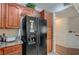 Spacious kitchen featuring wooden cabinets, granite countertops, and modern appliances at 689 Bay View Dr # 1311, Boulder City, NV 89005