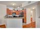 Open kitchen featuring granite countertops, wood cabinets, and stainless steel appliances at 689 Bay View Dr # 1311, Boulder City, NV 89005