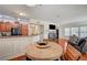 Open-concept living area features modern kitchen, fireplace, and view of the dining area at 689 Bay View Dr # 1311, Boulder City, NV 89005