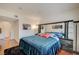 Comfortable main bedroom with mirrored headboard, soft lighting, and modern furniture at 689 Bay View Dr # 1311, Boulder City, NV 89005