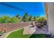 Paver patio with seating and low brick wall provides a private space to relax outside at 689 Bay View Dr # 1311, Boulder City, NV 89005