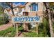 Wooden community sign reads 'Bayview,' set among desert plants and trees at 689 Bay View Dr # 1311, Boulder City, NV 89005