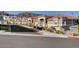 Street view of desert condos with red tiled roofs and drought-tolerant landscaping at 689 Bay View Dr # 1311, Boulder City, NV 89005