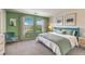 Serene main bedroom featuring a large window with natural light, comfortable bed, and stylish furnishings at 6928 Wrightshire St # 19, Las Vegas, NV 89166