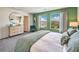 Bright main bedroom with a large window, dresser, and a neutral color scheme at 6928 Wrightshire St # 19, Las Vegas, NV 89166