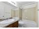 Bright bathroom featuring a single sink vanity with a tub and shower combination at 6997 Ray Charles Ln, Las Vegas, NV 89119