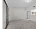 Large bedroom with slider doors, and a doorway leading to the bathroom area at 6997 Ray Charles Ln, Las Vegas, NV 89119