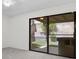 A bright room with sliding glass doors leading to a backyard oasis at 6997 Ray Charles Ln, Las Vegas, NV 89119