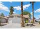 Charming single-story home features a well-manicured front yard, a two-car garage, and a classic stucco facade at 6997 Ray Charles Ln, Las Vegas, NV 89119