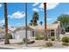 Charming single-story home features a well-manicured front yard, a two-car garage, and a classic stucco facade at 6997 Ray Charles Ln, Las Vegas, NV 89119