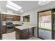 Bright kitchen with granite countertops, stainless steel appliances, and backyard access at 6997 Ray Charles Ln, Las Vegas, NV 89119