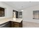 Kitchen island in bright kitchen with backyard view at 6997 Ray Charles Ln, Las Vegas, NV 89119