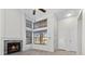 Living room features a fireplace, tile flooring, and plenty of natural light at 6997 Ray Charles Ln, Las Vegas, NV 89119