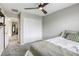 Bedroom with a ceiling fan, carpeted floor, and a closet for storage at 7061 Tilligerry St, North Las Vegas, NV 89084