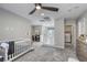 Open, airy space with gray carpeting and a combined living, sleeping and laundry area at 7061 Tilligerry St, North Las Vegas, NV 89084