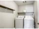 Laundry room with a washer and dryer and shelves for storage at 7061 Tilligerry St, North Las Vegas, NV 89084