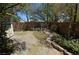 Backyard showcasing a patio area, rock accents, and fencing, creating a versatile outdoor space at 7518 Luna Del Rey St, Las Vegas, NV 89123