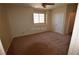 Bright bedroom with ceiling fan, window, and door creating a comfortable living space at 7518 Luna Del Rey St, Las Vegas, NV 89123