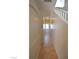 Hallway featuring tile floors and natural light, creating a warm and inviting transition space at 7518 Luna Del Rey St, Las Vegas, NV 89123