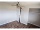 Bright bedroom showcasing ceiling fan, wood floors, and closet at 781 Buol Rd, Pahrump, NV 89048
