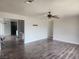 Spacious living room with wood flooring, ceiling fan and open floor plan at 781 Buol Rd, Pahrump, NV 89048