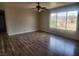Bright living room with wood flooring and large windows at 781 Buol Rd, Pahrump, NV 89048