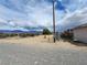 View of the yard, outbuildings, and landscape at 781 Buol Rd, Pahrump, NV 89048