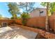 Landscaped backyard patio area with privacy wall, perfect for outdoor entertaining at 7923 Homer Ct, Las Vegas, NV 89139