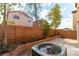 Private backyard with brick wall, patio, and low-maintenance landscaping, perfect for outdoor living at 7923 Homer Ct, Las Vegas, NV 89139