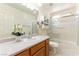 Bathroom with a single sink vanity and a shower-tub combination at 7923 Homer Ct, Las Vegas, NV 89139