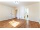 Bedroom with hardwood floors and a doorway to a bathroom at 7923 Homer Ct, Las Vegas, NV 89139