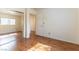 Bedroom with wood floors featuring a mirror sliding-door closet at 7923 Homer Ct, Las Vegas, NV 89139