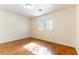 Bright bedroom with wood flooring, a window and neutral decor at 7923 Homer Ct, Las Vegas, NV 89139